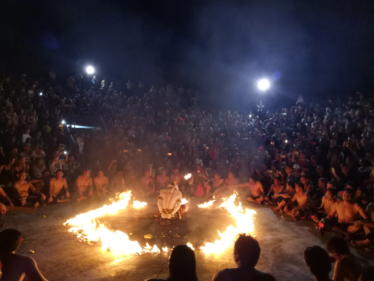 The fire finale of the Kecak dance performance at Uluwatu Temple at night
